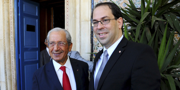 Newly named Tunisian Prime Minister Youssef Chahed Youssef, right, meets Mohamed Ennaceur, head of the Parliament in Tunis, Friday Aug. 26, 2016 ahead of a confidence vote. (AP Photo/Riadh Dridi)