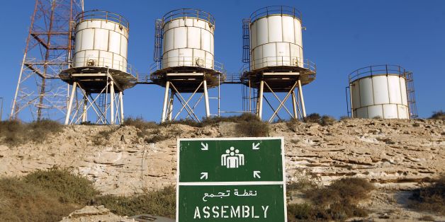A picture shows silos at the Zueitina oil terminal on September 14, 2016.Forces opposed to Libya's unity government handed management of four vital oil ports to the National Oil Company on September 14, after seizing them in a blow to fragile peace efforts. Prime minister-designate Fayez al-Sarraj called for urgent talks after the ports were captured by forces loyal to Field Marshal Khalifa Haftar, who supports a rival administration in the country's east. / AFP / Abdullah DOMA (Photo cre