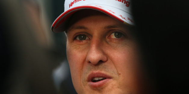 Mercedes driver Michael Schumacher of Germany talks to reporters after he failed to finish in the Indian Formula One Grand Prix at the Buddh International Circuit in Noida, on the outskirts of New Delhi, India, Sunday, Oct. 28, 2012. (AP Photo/Manish Swarup)