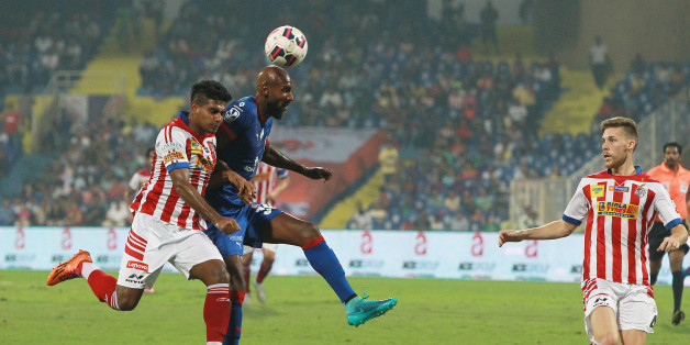 MUMBAI, INDIA - NOVEMBER 1: Captain of Mumbai City FC Anelka trying to go past of Atletico de Kolkata defense during Indian Super League match at DY Patil stadium on November 1, 2015 in Navi Mumbai, India. (Photo by Arijit Sen/Hindustan Times via Getty Images)