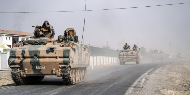 FILE- In this Thursday, Aug. 25, 2016 file photo, Turkish army tanks and armored personnel carriers move toward the Syrian border, in Karkamis, Turkey. Turkey's military said Sunday, Sept. 11, 2016, its warplanes have killed 20 Islamic State group fights in an attack on targets in northern Syria, while Turkey's president renewed a pledge to destroy the group. (AP Photo/Halit Onur Sandal, File)