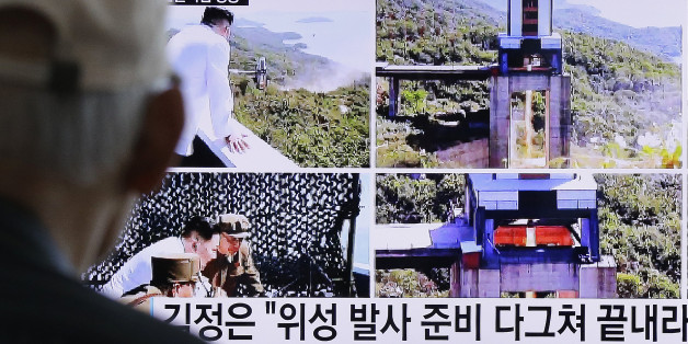 A man watches a TV news showing images that North Korea's Rodong Sinmun newspaper reports of the ground test of a high-powered engine of a carrier rocket and North Korean leader Kim Jong Un at the country's Sohae Space Center, at Seoul Railway station in Seoul, South Korea, Tuesday, Sept. 20, 2016. North Korean leader Kim has overseen a ground test of a new rocket engine and ordered a satellite launch preparation, state media said Tuesday, an indication the country might soon conduct a prohibited long-range rocket launch. The letters read "Kim Jong Un directed the ground test of a high-powered engine of a carrier rocket for a geo-stationary satellite." (AP Photo/Ahn Young-joon)