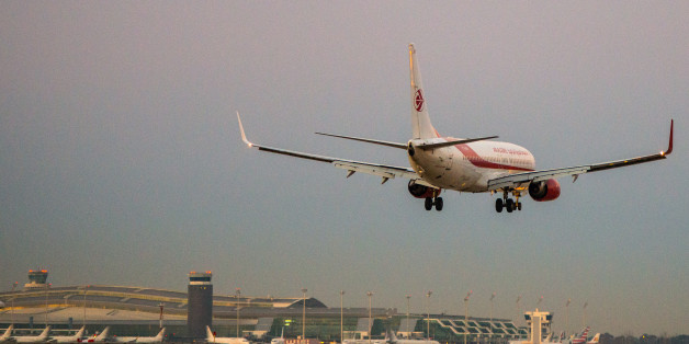 BARCELONA, SPAIN - FEBRUARY 11: A plane operated by Air Algerie lands at Aena operated Barcelona - El Prat International Airport on February 11, 2015 in Barcelona, Spain. Shares in state-controlled Spanish airports operator, Aena, began trading today on the Madrid stock market. The Spanish government will retain a 51% controlling share in the firm, as it seeks to raise 3.9 billion Euros through the sale of the remaining 49%. Aena operates major hubs in Barcelona and Madrid, as well as a further