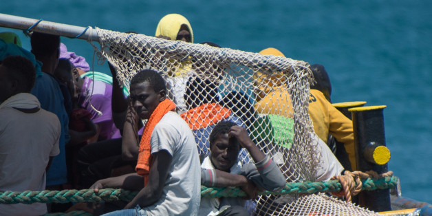 CORIGLIANO CALABRO, ITALY - 2016/05/30: About 400 African migrants, sub-Saharan, disembarked in the port of Corigliano Calabro, southern Italy, from the ship Dignity I of Doctors Without Borders. Among them 360 men, 40 women with children and at least 60 unaccompanied minors. They were rescued by boats in the sea in front of the Libyan coast. In the last week in the Italian ports they have arrived more than 13,000 migrants, and in the Mediterranean there have been more than 700 victims. (Photo b