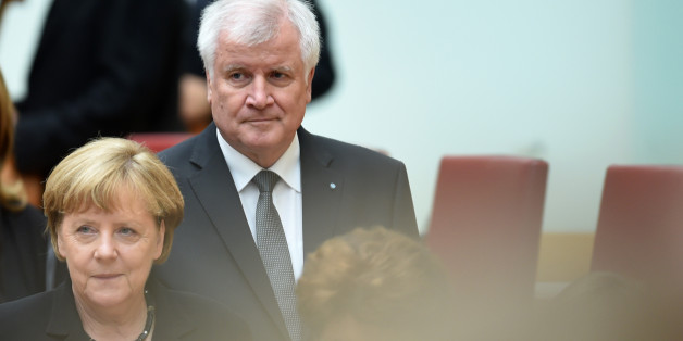 German Chancellor Angela Merkel (L) and the Bavarian State Premier Horst Seehofer arrive for a commemoration ceremony at the Bavarian parliament in Munich, southern Germany, on July 31, 2016 for the victims of a shooting rampage in Munich on July 22.
Addressing the Bavarian parliament in the second of the day's memorial events, Gauck said attackers and terrorists 'will not force us to hate as they hate.' / AFP / CHRISTOF STACHE (Photo credit should read CHRISTOF STACHE/AFP/Getty Images)