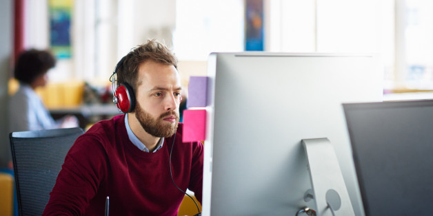 Businessman on computer at office workstation
