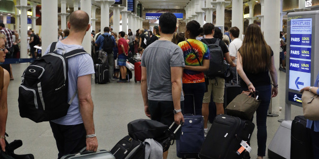 FILE- In this Thursday, July 2, 2015 file photo, people queue as they wait at the St. Pancras international train station terminal in London. Britain's immigration minister says U.K. citizens may have to pay for visas to visit European Union nations after the country leaves the bloc. (AP Photo/Frank Augstein, File)