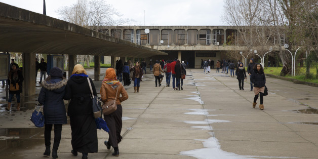 ALGIERS, ALGERIA - JANUARY 25: Students walk across campus of University of Sciences and Technology Houari Boumediene in January 25, 2015 in Algiers, Algeria. The university buildings were designed by architect Oscar Niemeyer (Photo by Thomas Trutschel/Photothek via Getty Images)