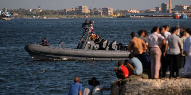 A Comoros Islands' cargo ship is seen partly sinking in the Egyptian port of Port Said, around 160 km, northeast of Cairo, February 21, 2009. According to Egyptian maritime sources, the ship which had a crew of seven Egyptian sailors, was on its way to crossing the Suez Canal, when the ship's direction system failed and the ship's front started sinking. REUTERS/Stringer (EGYPT)