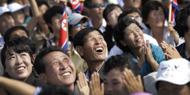 North Koreans watch an aerial display on Saturday, Sept. 24, 2016, in Wonsan, North Korea. North Korea on Saturday opened an air festival featuring sky diving, demonstrations by its air force and lots of beer to promote a newly renovated and upgraded commercial airport in the coastal city of Wonsan that it hopes will draw for foreign tourists. (AP Photo/Wong Maye-E)