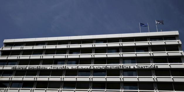 A European Union (L) and a Greek national flag flutter atop the Greek Finance Ministry in Athens May 6, 2015. The European Central Bank's Governing Council on Wednesday may nudge up the amount of Emergency Liquidity Assistance teetering Greek banks can borrow, as Athens struggles to avert a potentially catastrophic funding crunch. REUTERS/Alkis Konstantinidis