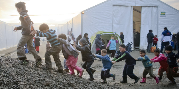 Children play on a pile of gravel at the northern Greek border point of Idomeni, Greece, Friday, March 18, 2016. More than 46,000 people are trapped in Greece, after Austria and a series of Balkan countries stopped letting through refugees who reach Greece from Turkey and want to go to Europe's prosperous heartland while Greece wants refugees to move from Idomeni to organized shelters. (AP Photo/Vadim Ghirda)