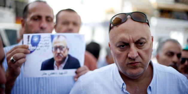 Majed Hattar (R), brother of the Jordanian writer Nahed Hattar, speaks to the media during a sit-in in the town of Al-Fuheis near Amman, Jordan, September 25, 2016. REUTERS/Muhammad Hamed TPX IMAGES OF THE DAY