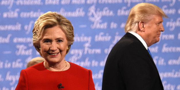 Democratic nominee Hillary Clinton (L) and Republican nominee Donald Trump leave the stage after the first presidential debate at Hofstra University in Hempstead, New York on September 26, 2016. / AFP / Timothy A. CLARY (Photo credit should read TIMOTHY A. CLARY/AFP/Getty Images)