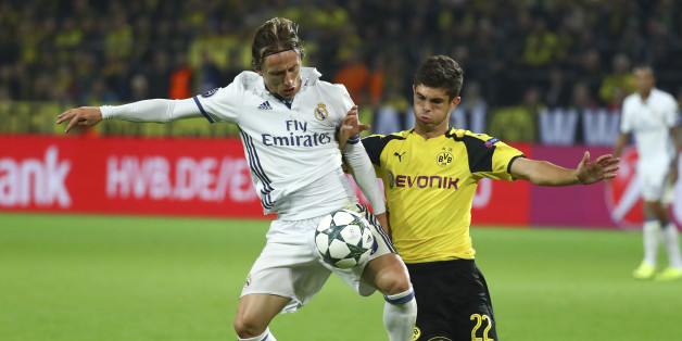 Football Soccer - Borussia Dortmund v Real Madrid - UEFA Champions League group stage - Group F - Signal Iduna Park stadium, Dortmund, Germany - 27/09/16 - Real Madrid's Luka Modric and Dortmund's Christian Pulisic in action REUTERS/Kai Pfaffenbach