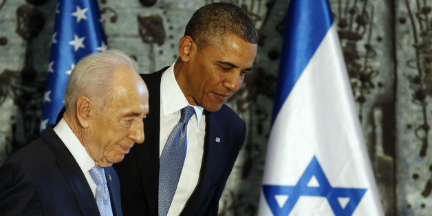 U.S. President Barack Obama (R) walks off stage together with Israel's President Shimon Peres after signing a guest book in Jerusalem, March 20, 2013. Making his first official visit to Israel, Obama pledged on Wednesday unwavering commitment to the security of the Jewish State where concern over a nuclear-armed Iran has clouded bilateral relations. REUTERS/Larry Downing (JERUSALEM - Tags: POLITICS)