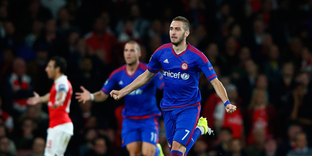 LONDON, ENGLAND - SEPTEMBER 29: Kostas Fortounis of Olympiacos celebrates the own goal scored by David Ospina of Arsenal during the UEFA Champions League Group F match between Arsenal FC and Olympiacos FC at the Emirates Stadium on September 29, 2015 in London, United Kingdom. (Photo by Shaun Botterill/Getty Images)