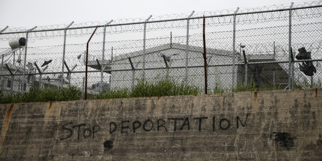 A slogan reading 'Stop Deportation' is seen on a wall at the Moria registration centre on the Lesbos island, Greece March 22, 2016. REUTERS/Alkis Konstantinidis