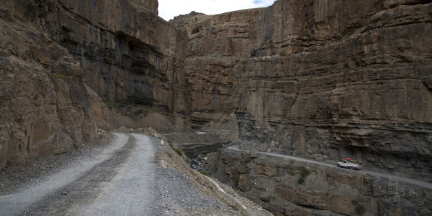 In this Aug. 15, 2016, photo, a car drives along a mountain road that leads to Spiti Valley, a remote Himalayan valley situated at 4000 meter above sea level, India. It takes about ten hours to reach from Manali, a city in Himachal Pradesh. For centuries, the sleepy valley nestled in the Indian Himalayas remained a hidden Buddhist enclave forbidden to outsiders. That's all now starting to change, for better or worse, since India began allowing its own citizens as well as outsiders to visit the valley in the early 1990s. (AP Photo/Thomas Cytrynowicz)