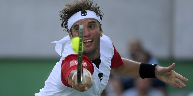 2016 Rio Olympics - Tennis - Preliminary - Men's Singles First Round - Olympic Tennis Centre - Rio de Janeiro, Brazil - 06/08/2016. Malek Jaziri (TUN) of Tunisia in action against Jo-Wilfried Tsonga (FRA) of France. REUTERS/Toby Melville FOR EDITORIAL USE ONLY. NOT FOR SALE FOR MARKETING OR ADVERTISING CAMPAIGNS.