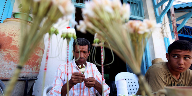 A florist prepares machmoum, or jasmine bouquets, in the center of Testour, Tunisia August 31, 2016. Picture taken August 31, 2016. REUTERS/Zoubeir Souissi.