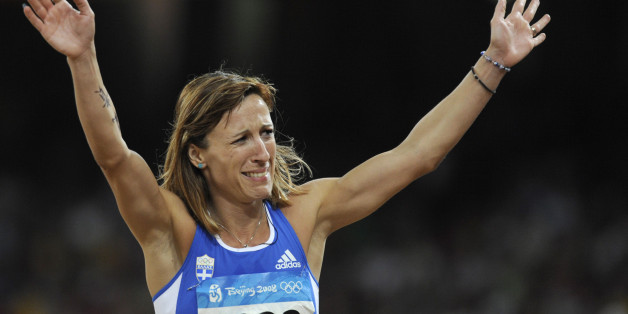 Hrysopiyi Devetzi of Greece reacts whilst competing in the women's triple jump final of the athletics competition in the National Stadium at the Beijing 2008 Olympic Games August 17, 2008. REUTERS/Kai Pfaffenbach (CHINA)