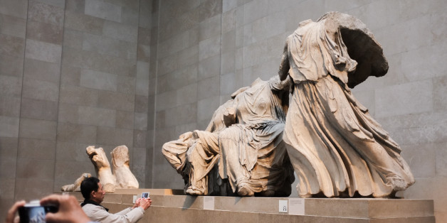Tourists visit the Parthenon gallery at the British Museum in London, on March 30, 2015. A legal team in Athens is currently trying to have the marbles returned to Greece (Photo by Jay Shaw Baker/NurPhoto) (Photo by NurPhoto/NurPhoto via Getty Images)