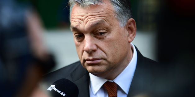 Hungarian Prime Minister Viktor Orban reacts as he answers to the journalists in front of a polling station at a school in Budapest, on October 2, 2016. Hungarians vote in a referendum on taking migrants as part of an EU-wide mandatory quota scheme, a plan rejected by right-wing Prime Minister Viktor Orban. / AFP / ATTILA KISBENEDEK (Photo credit should read ATTILA KISBENEDEK/AFP/Getty Images)
