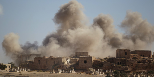 Smoke rises behind the ancient castle of the rebel-controlled town of Maaret al-Numan after airstrikes in Idlib province, Syria, September 25, 2016. REUTERS/Khalil Ashawi
