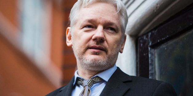 WikiLeaks founder Julian Assange addresses the media from the balcony of the Ecuadorian embassy in central London on February 5, 2016.During a press conference on February 5 Julian Assange, speaking via video-link, called for Britain and Sweden to 'implement' a UN panel finding saying that he should be able to walk free from Ecuador's embassy, where he has lived in self-imposed confinement since 2012. / AFP / Jack Taylor (Photo credit should read JACK TAYLOR/AFP/Getty Images)