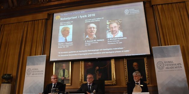 (L-R) The acting chairman of the Nobel Committee for Physics Nils Martensson, the Permanent Secretary of the Royal Swedish Academy of Sciences Goran K Hansson and Thors Hans Hansson, member of the Nobel Committee for Physics sit in front of a screen displaying the winners of the Nobel Prize in Physics (L-R) David J Thouless, F Duncan M Haldane and J Michael Kosterlitz during a press conference to announce the winner of the 2016 Nobel Prize in Physics at the Royal Swedish Academy of Sciences in Stockholm on October 4, 2016.
David J. Thouless, F. Duncan M. Haldane and J. Michael Kosterlitz were awarded the 2016 Nobel Physics Prize 'for theoretical discoveries of topological phase transitions and topological phases of matter'. / AFP / JONATHAN NACKSTRAND (Photo credit should read JONATHAN NACKSTRAND/AFP/Getty Images)