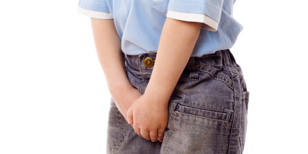 Little boy need a pee, isolated on white