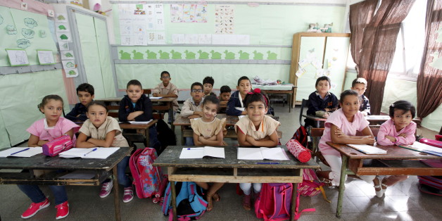 Students cross their arms to demonstrate they are listening carefully to their teacher at Al Hakim El Kassar Primary School in Tunis, Tunisia, September 16, 2015. Schools have reopened, with around 2 million pupils heading back to classrooms after a three-month summer break. Nearly three years after Taliban gunmen shot Pakistani schoolgirl Malala Yousafzai, the teenage activist last week urged world leaders gathered in New York to help millions more children go to school. World Teachers' Day falls on 5 October, a Unesco initiative highlighting the work of educators struggling to teach children amid intimidation in Pakistan, conflict in Syria or poverty in Vietnam. Even so, there have been some improvements: the number of children not attending primary school has plummeted to an estimated 57 million worldwide in 2015, the U.N. says, down from 100 million 15 years ago. Reuters photographers have documented learning around the world, from well-resourced schools to pupils crammed into corridors in the Philippines, on boats in Brazil or in crowded classrooms in Burundi. REUTERS/Anis MiliPICTURE 27 OF 47 FOR WIDER IMAGE STORY "SCHOOLS AROUND THE WORLD"SEARCH "EDUCATORS SCHOOLS" FOR ALL IMAGES