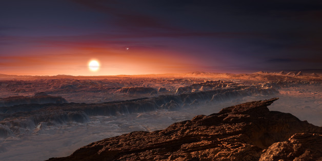 A hand out image made available by the European Southern Observatory on August 24 2016, shows an artist's impression of a view of the surface of the planet Proxima b orbiting the red dwarf star Proxima Centauri, the closest star to the Solar System. The double star Alpha Centauri AB also appears in the image to the upper-right of Proxima itself. Proxima b is a little more massive than the Earth and orbits in the habitable zone around Proxima Centauri, where the temperature is suitable for liquid