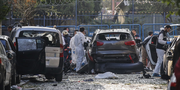 Police officers work at the scene of a blast in Istanbul, Thursday, Oct. 6, 2016. A bomb placed on a motorcycle has exploded near a police station Thursday, wounding several people, Vasip Sahin, the governor for Istanbul, said. Turkish authorities have banned distribution of images relating to the explosion within Turkey. (AP Photo/Emrah Gurel)