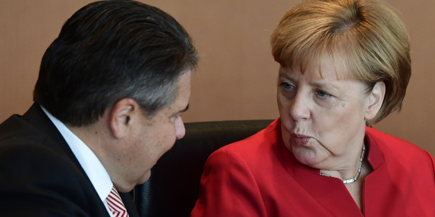 German Chancellor Angela Merkel chats with Vice Chancellor, Economy and Energy Minister Sigmar Gabriel before the weeky cabinet meeting in Berlin on September 28, 2016. / AFP / TOBIAS SCHWARZ (Photo credit should read TOBIAS SCHWARZ/AFP/Getty Images)
