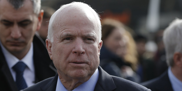 U.S. Senator John McCain arrives on a visit at a migrant center near the village of Adasevci, Serbia February 12, 2016. REUTERS/Marko Djurica/File Photo
