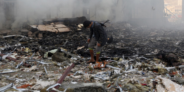 A Yemeni inspects the rubble of a destroyed building following reported airstrikes by Saudi-led coalition air-planes on the capital Sanaa on October 8, 2016.Rebels in control of Yemen's capital accused the Saudi-led coalition fighting them of killing or wounding dozens of people in air strikes on Sanaa. The insurgent-controlled news site sabanews.net said that coalition planes hit a building in the capital where people had gathered to mourn the death of an official, resulting in 'dozens of dead