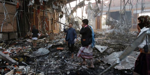 Yemeni rescue workers search for victims amid the rubble of a destroyed building following reported airstrikes by Saudi-led coalition air-planes on the capital Sanaa on October 8, 2016.Rebels in control of Yemen's capital accused the Saudi-led coalition fighting them of killing or wounding dozens of people in air strikes on Sanaa. The insurgent-controlled news site sabanews.net said that coalition planes hit a building in the capital where people had gathered to mourn the death of an official, r