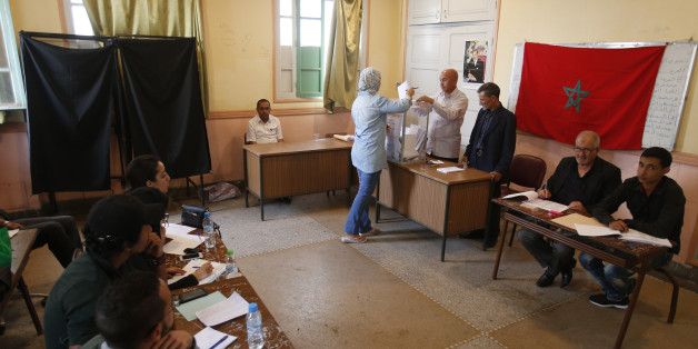 A Moroccan woman casts her ballot at a polling station for the parliamentary elections, in Rabat, Morocco, Friday, Oct. 7, 2016. Amid worries about jobs and extremism, millions of Moroccans voted Friday in parliamentary elections that will determine whether moderate Islamists will keep control of the government or lose power to a young rival party close to the powerful royal palace. (AP Photo/Abdeljalil Bounhar)