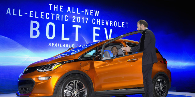 President Barack Obama sits in a new Chevrolet Bolt electric car as he visits the 2016 North American International Auto Show in Detroit, Wednesday, Jan. 20, 2016, to highlight the progress made by the American auto industry. (AP Photo/Carolyn Kaster)