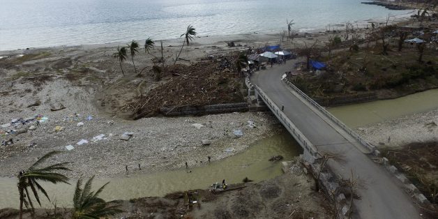 Aerial picture showing the destruction caused by Hurricane Matthew in Port-Salut, southwest of Port-au-Prince, on October 9, 2016, days after the passage of the hurricane through Haiti.
Haiti began three days of mourning on Sunday for hundreds killed in Hurricane Matthew as relief officials grappled with the unfolding devastation in the Caribbean country's hard-hit south. And nearly a week after being devastated by the hurricane, Haiti is confronted with a growing cholera outbreak threatening to turn its disaster even more deadly. / AFP / Nicolas GARCIA (Photo credit should read NICOLAS GARCIA/AFP/Getty Images)
