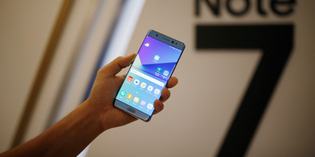 A model poses for photographs with a Galaxy Note 7 new smartphone during its launching ceremony in Seoul, South Korea, August 11, 2016. REUTERS/Kim Hong-Ji/File Photo