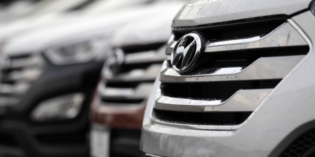 This Thursday, Oct. 4, 3012, photo, shows a white Hyundai Santa Fe outside of a Hyundai car dealership in Des Planines, Ill. Twenty-two percent of cars and trucks built for the 2012 model year have white paint, making it the most popular color worldwide. Silver is close behind, at 20 percent, followed by black at 19 percent. Gray and red round out the top five, according to a survey released Wednesday, Oct. 10, 2012 by automotive paint maker PPG. (AP Photo/Nam Y. Huh)