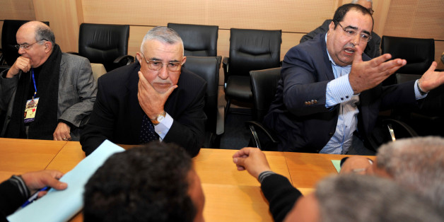 Abdelouahed Radi (2-R), secretary general of Morocco's Socialist Party (USFP) listens to questions as party members Driss Lachgar (R) speaks and Fathallah Oualalou (L) looks on at the National council in Rabat on March 19, 2011. Radi spoke during a session regarding recent protests across the country. AFP PHOTO / ABDELHAK SENNA (Photo credit should read ABDELHAK SENNA/AFP/Getty Images)