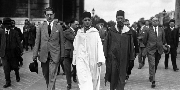 The Sultan of Morocco, Mohammed V wearing white robes, walking with the Grand Vizier, Si Mohammed El Mokri after he placed his wreath on the Tomb of the Unknown Warrior at the Arc De Triomphe during a visit to Paris, France around July 4, 1930. (AP Photo)