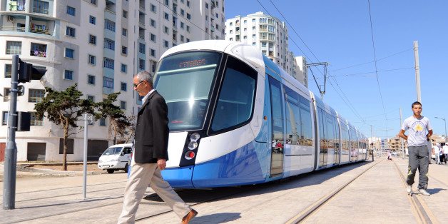 Men walk along the tracks of Algiers new tramway system which opened on May 8, 2011. After a two-year delay, the new tramway service opened, starting with a 7.2 km section running between Bordj El Kiffan and Bab-Ezzouar, serving residents in the densely populated eastern part of the city. AFP PHOTO / FAROUK BATICHE (Photo credit should read FAROUK BATICHE/AFP/Getty Images)