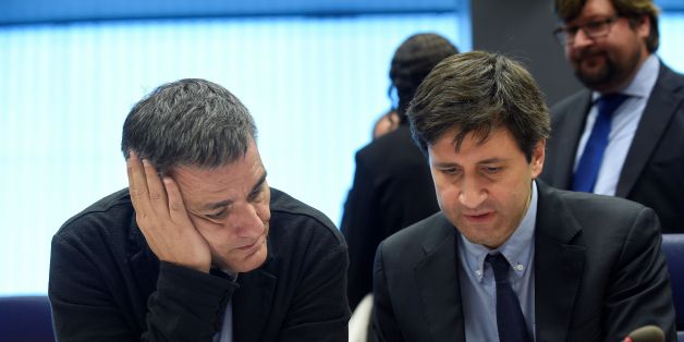 Greek Finance Minister Euclid Tsakalotos (L) listens to a Greek advisor during an Eurogroup meeting in Luxembourg on October 10, 2016.Greece has delivered the reforms necessary to unlock 2.8 billion euros in rescue loans from its massive third bailout, the European Commission's top economics affairs official said on October 10, 2016. / AFP / JOHN THYS (Photo credit should read JOHN THYS/AFP/Getty Images)
