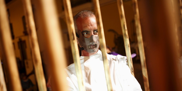 A man dressed as the character of Hannibal Lecter from the movie "The Silence of the Lambs" looks on as he takes part in the second edition of "Noche del Terror" (Horror night) during Halloween celebrations in the neighborhood of Churriana, near Malaga, southern Spain, October 31, 2015. REUTERS/Jon Nazca