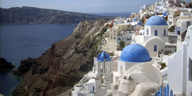 This Sept. 21, 2009 photo shows a view of Oia village on the island of Santorini, Greece. The Greek island of Santorini offers seaside tavernas, cliffside paths, black volcanic rocks and of course, sunshine and the Aegean. (AP Photo/Michael Virtanen)